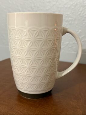 Laurie Gates Madrina 20 oz Cream embossed geometric design + exposed clay base.
